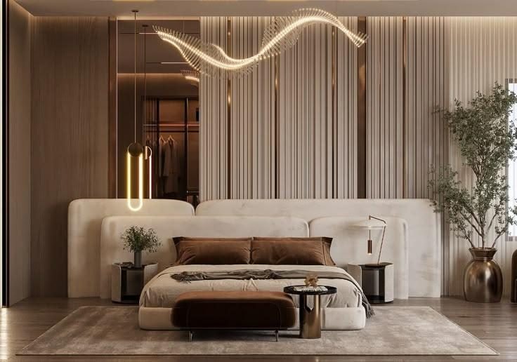Bedroom with a fluted feature wall, sculptural light installation and a low upholstered bed
