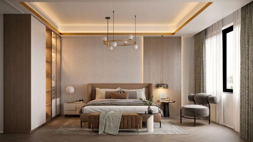 Neutral bedroom with a cove-lit ceiling, globe pendant lights, upholstered bed and sheer curtains
