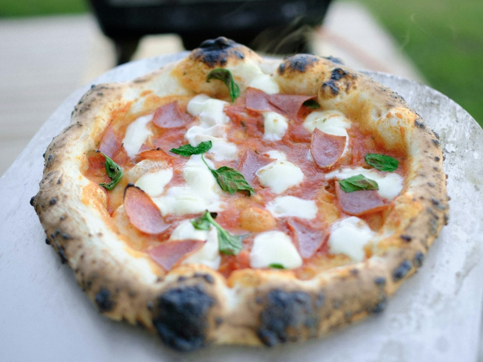 Neapolitan pizza with a charred, leopard-spotted crust