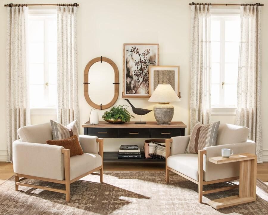 Reading corner with linen curtains, two armchairs, console and wall mirror