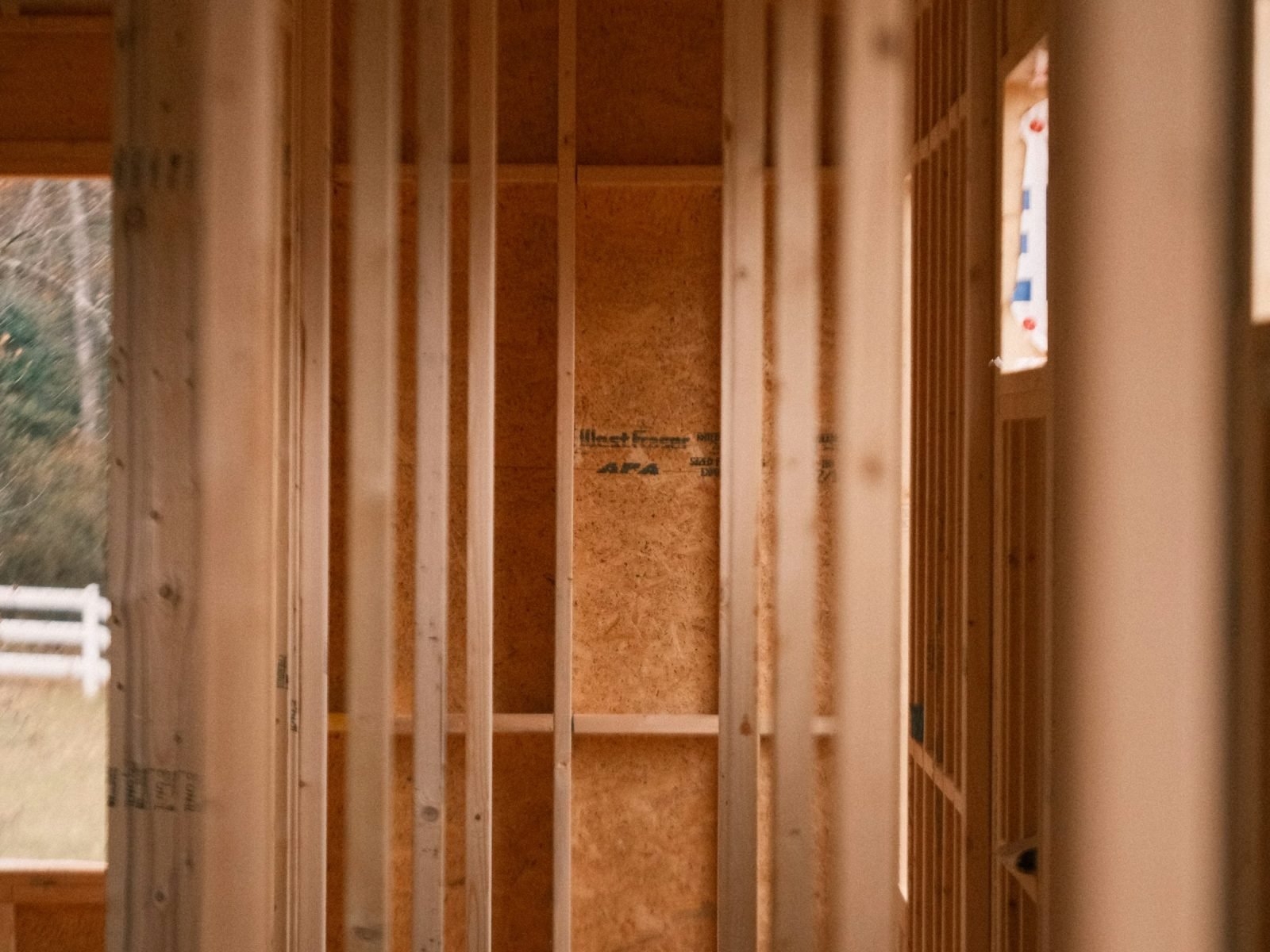 Timber stud framing with evenly spaced uprights